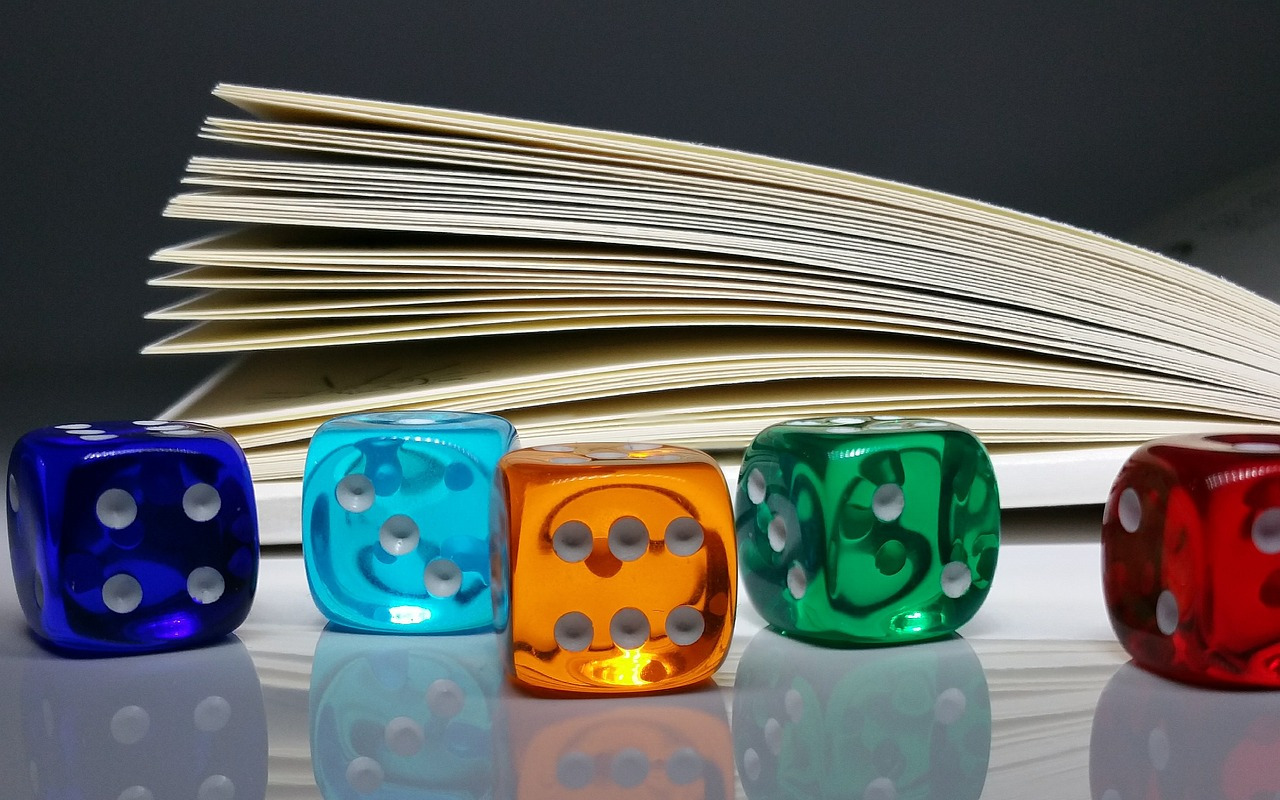 Dice next to a book