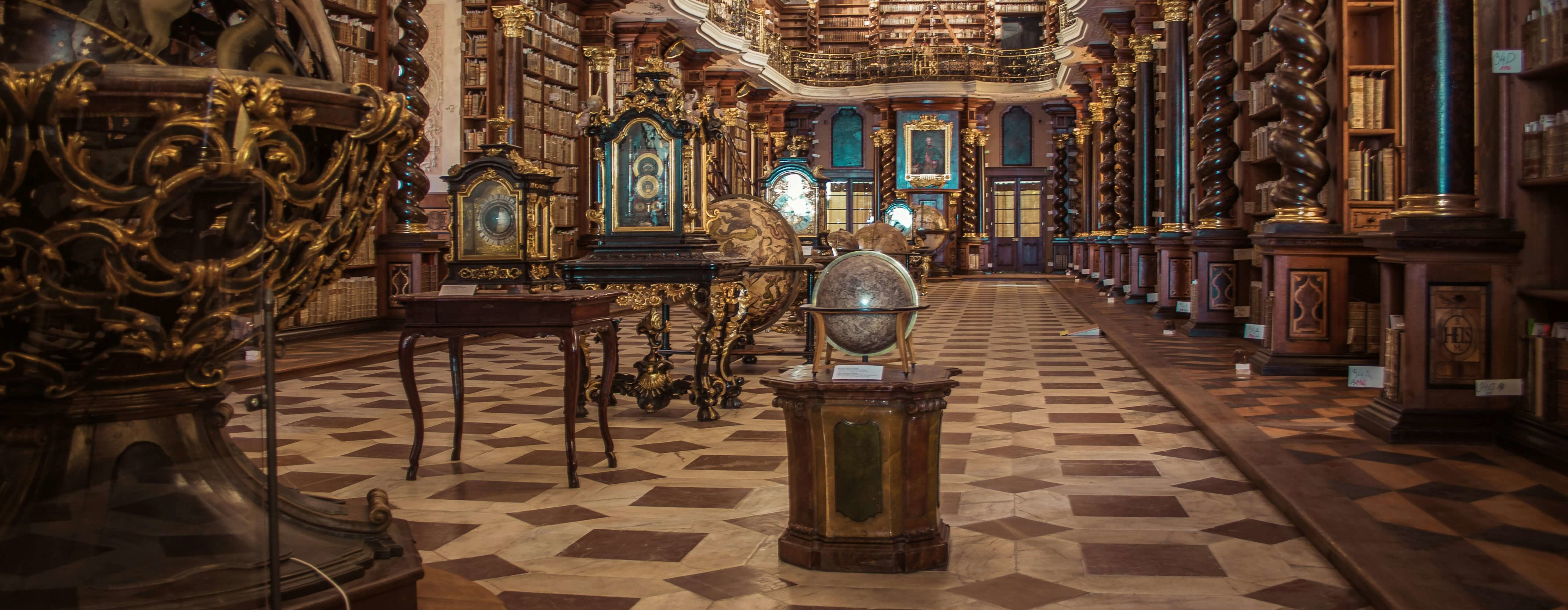 Interior of an old, ornate library filled with astrological instruments