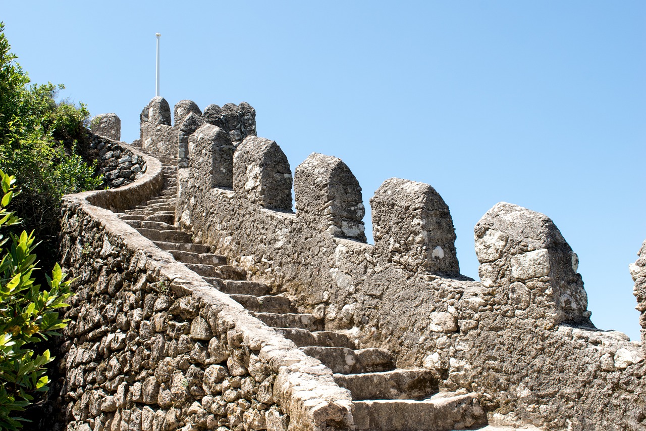 Stone stairs leading upwards with blue sky background