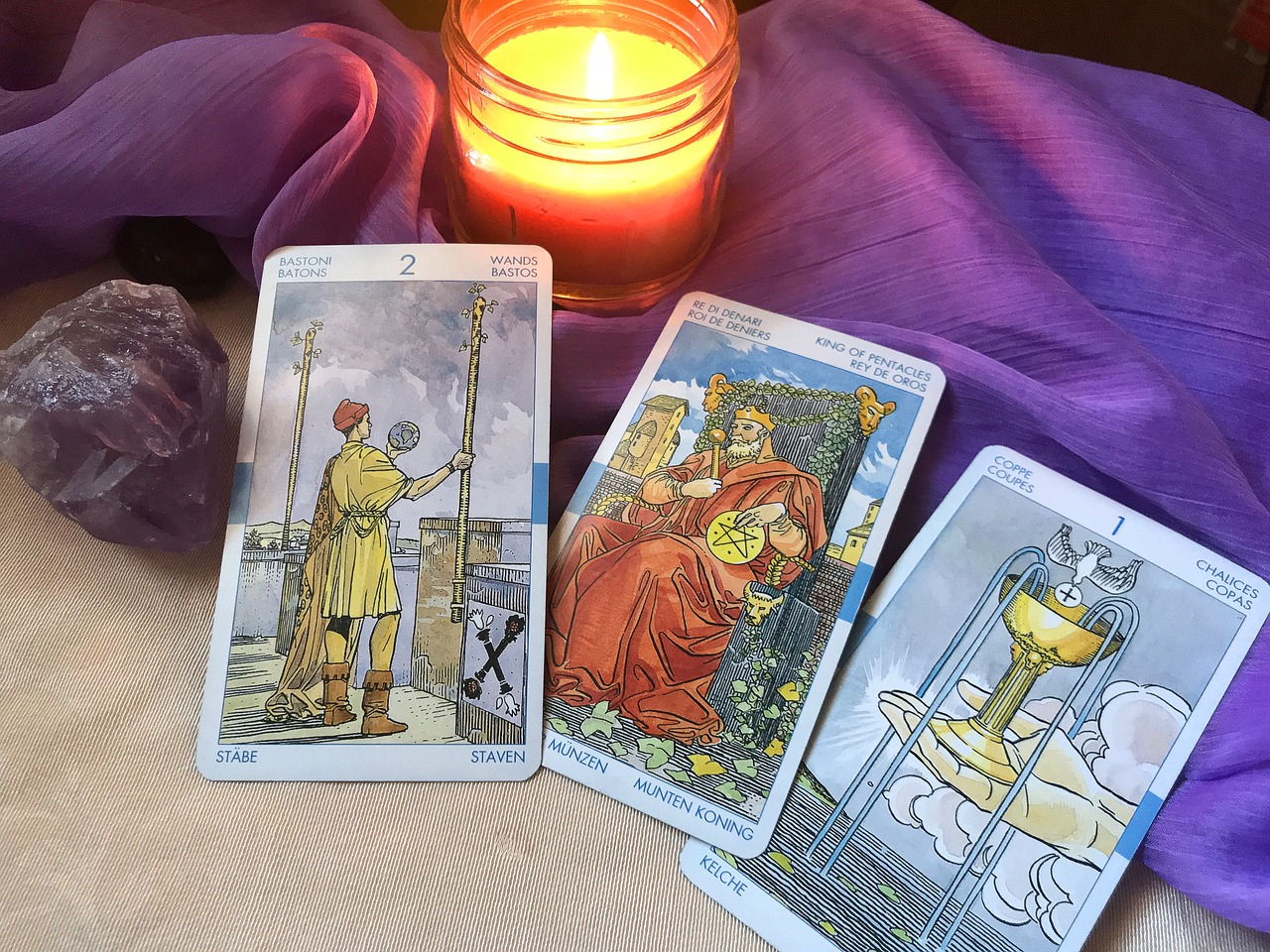 Three Minor Arcana cards on a table