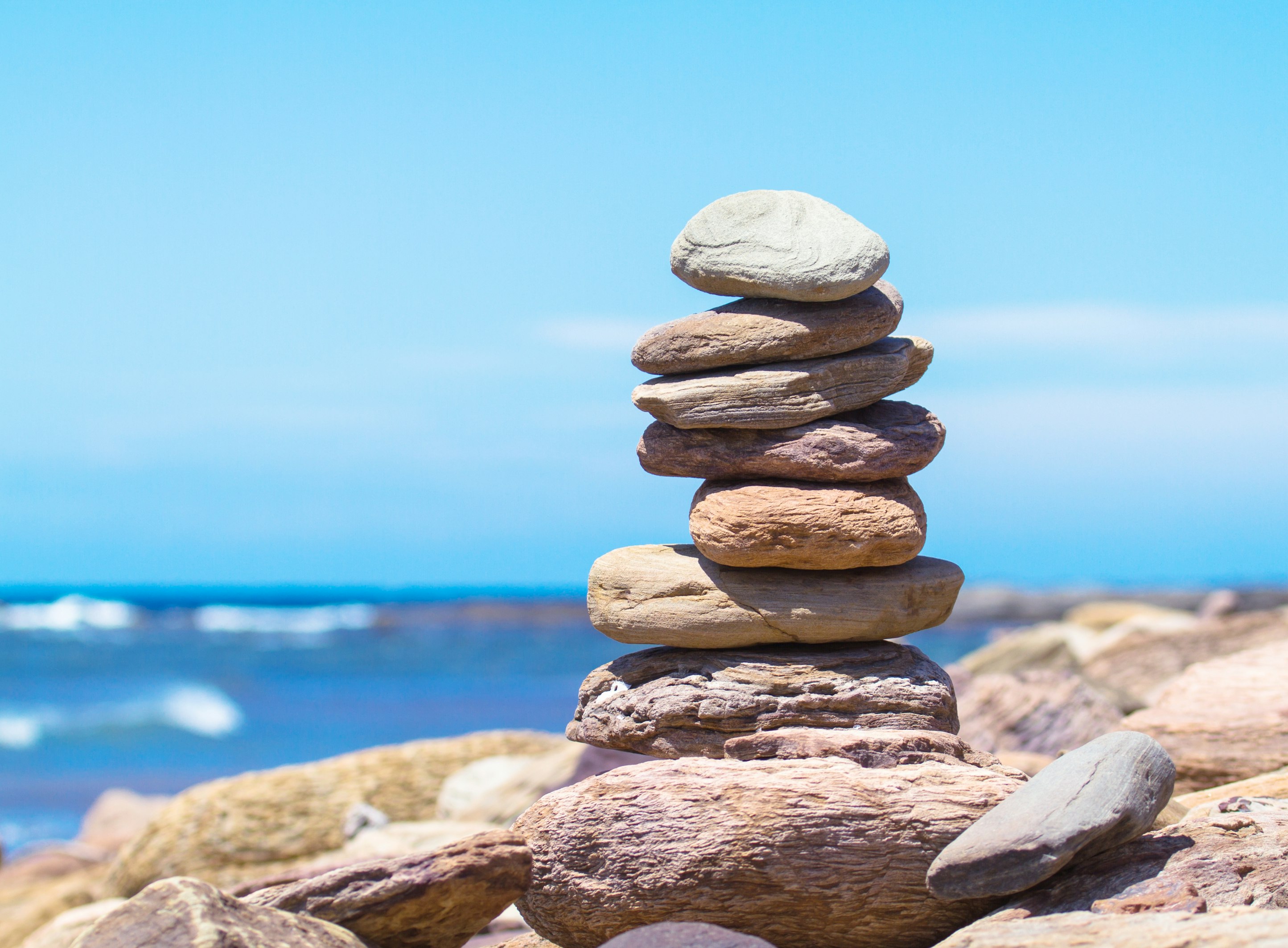 Stack of balanced stones on a beach