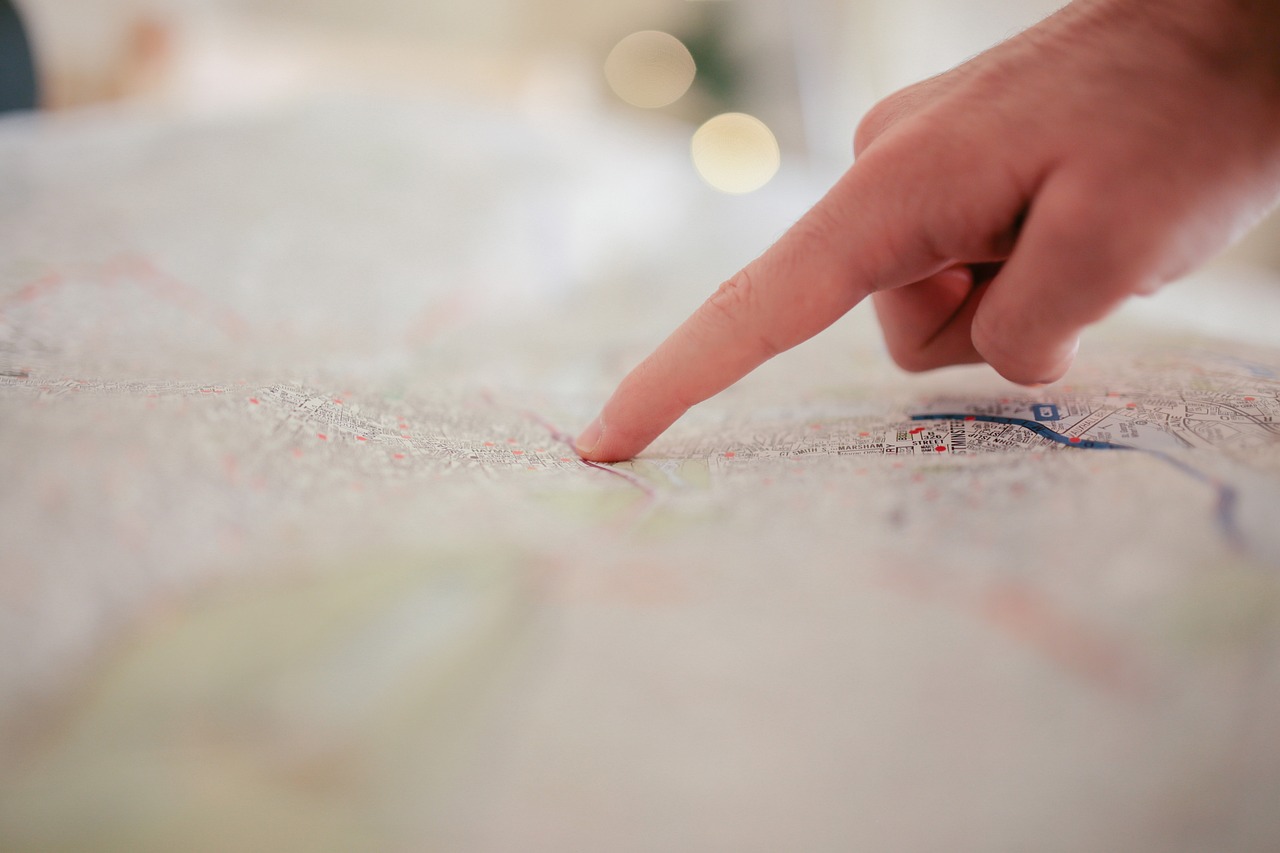 Person pointing at a map